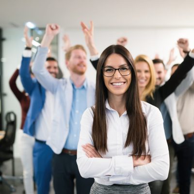 Portrait of group of successful businesspeople happy at work